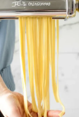 Homemade pasta dish with creamy tomato sauce and spinach, showcasing delicious pasta recipes.