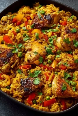 Delicious Caribbean chicken served with rice and vibrant spices.