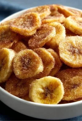 Cinnamon-sugar air fryer banana chips, a delicious and healthy snack alternative.