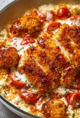 Cottage Cheese Chicken Parmesan Bowl with melted cheese and herbs