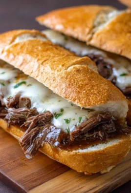 Delicious Crockpot French Dip Sandwiches served with au jus