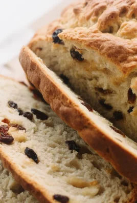 A delicious loaf of homemade Irish soda bread served on a wooden table.