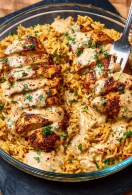 High Protein Creamy Cajun Chicken and Rice dish with vibrant spices and rice.