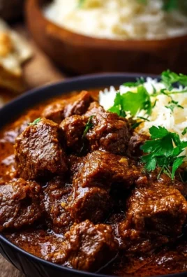 A delicious bowl of Lamb Madras Curry garnished with herbs and spices