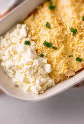 Low carb white chicken enchiladas served on a plate with garnishes.