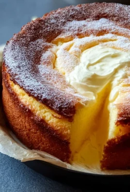 Delicious melt-in-your-mouth cake on a white plate with a slice removed