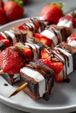 Sweet strawberry brownie kabobs served at a party for easy dessert enjoyment.