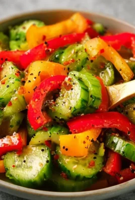Viral TikTok cucumber and bell pepper salad served in a bowl