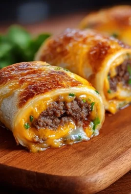 Garlic Butter Beef Cheeseburger Rollups served on a plate