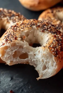 Freshly baked Greek yogurt bagels on a wooden board