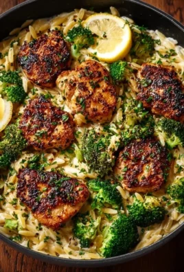 Plate of Lemon Pepper Chicken served with broccoli orzo.
