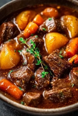 Pioneer Woman's Crockpot Beef Stew topped with fresh herbs
