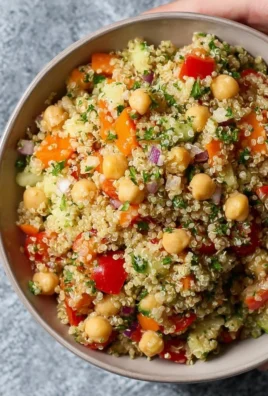 Colorful Quinoa Chickpea Salad with fresh vegetables and herbs