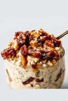 Bowl of Sea Salt and Date Overnight Oats topped with fruits and nuts