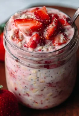 Delicious strawberries and cream overnight oats in a mason jar