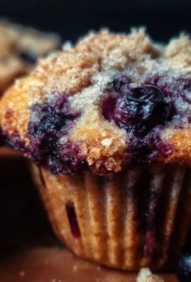 Freshly baked to die for blueberry muffins on a cooling rack
