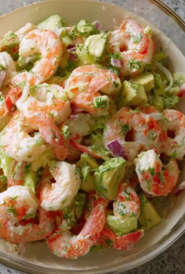 Plate of upgraded classic shrimp salad with fresh ingredients and vibrant colors