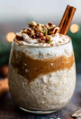 A bowl of vanilla chai overnight oats topped with spices and fruits