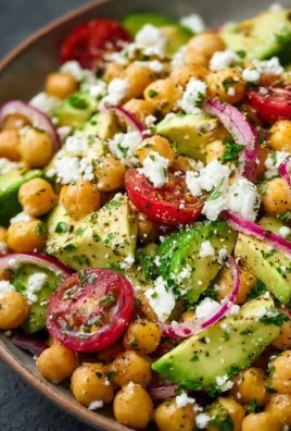 Chickpea Feta Avocado Salad with fresh vegetables in a bowl