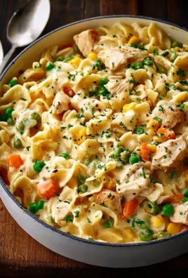 Classic chicken pot pie pasta served in a bowl with vegetables and chicken