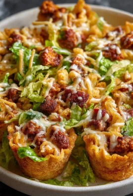 A delicious plate of easy taco cups filled with toppings and served on a table.