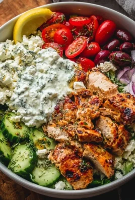 Delicious Greek Chicken Bowls with fresh vegetables and flavorful seasonings.