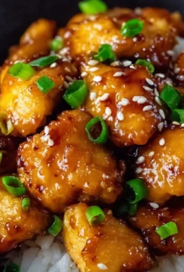 Delicious Honey Garlic Chicken served with vegetables on a plate.