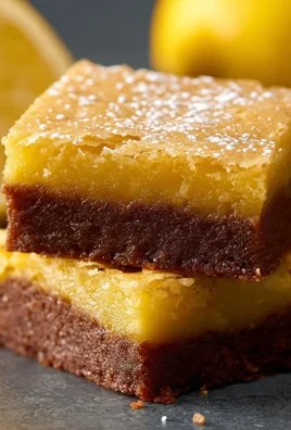 Delicious homemade lemon brownies with icing on a plate