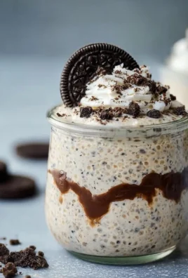 Delicious OREO overnight oats prepared in a jar with chocolate and cream layers.