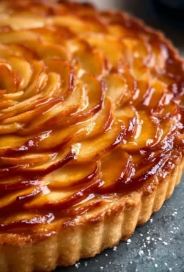 Salted Caramel Apple Rosette Tart topped with drizzled caramel