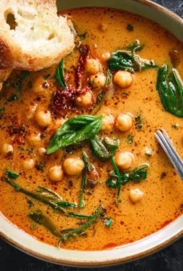 Delicious bowl of Tuscan Garbanzo Bean Soup garnished with herbs