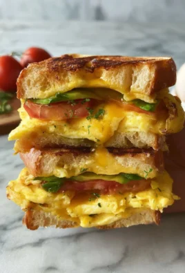 Vegetarian breakfast egg sandwich with fresh vegetables and grilled egg