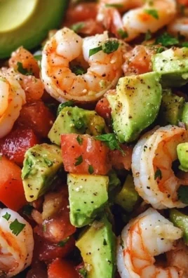 A vibrant Avocado Salsa Shrimp Salad served in a bowl with fresh ingredients