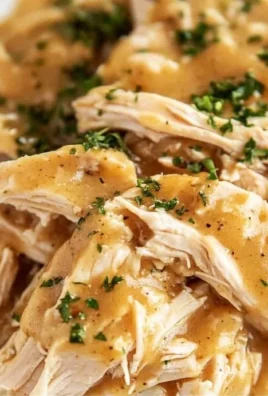 Delicious crockpot chicken and gravy served in a bowl