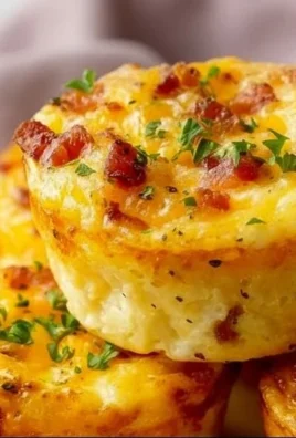 Cheesy muffin tin cottage cheese egg bites fresh out of the oven.