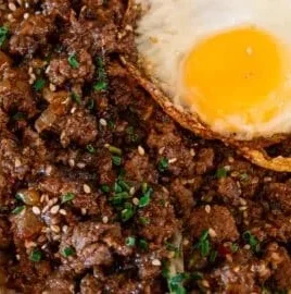 Crispy beef rice bowl prepared in 20 minutes with colorful toppings