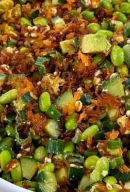 Vibrant crispy rice salad with fresh vegetables and herbs