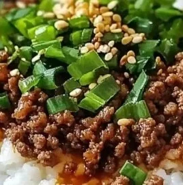 Korean Ground Beef Bowl garnished with vegetables and sesame seeds