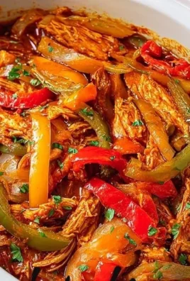 Delicious Easy Crockpot Chicken Fajitas served with fresh toppings