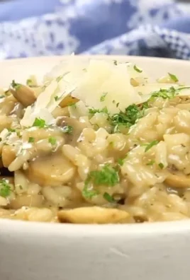 Delicious easy mushroom risotto served in a bowl with herbs on top.