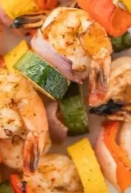 Grilled shrimp kabobs with colorful vegetables on skewers