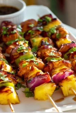 Delicious Hawaiian Chicken Kebabs grilled with pineapple and bell peppers