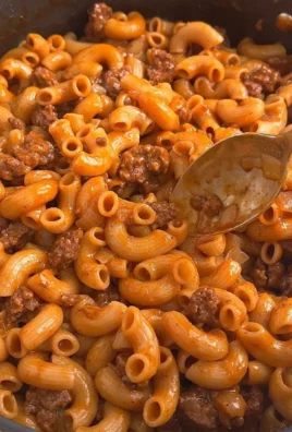 A bowl of homemade Hamburger Helper with ground beef and pasta.