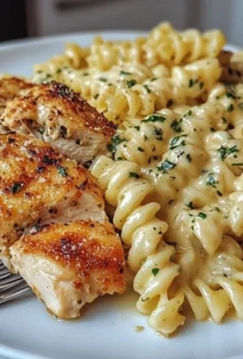 Plate of Honey Garlic Chicken Pasta with garlic and herbs