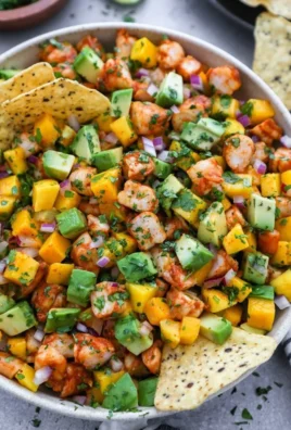 Colorful Mango Avocado Shrimp Salad with fresh ingredients and vibrant presentation.