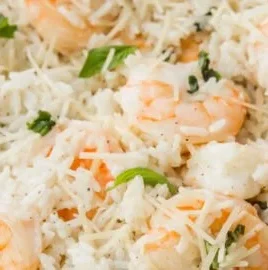 Delicious Parmesan Basil Shrimp served over rice in a white bowl