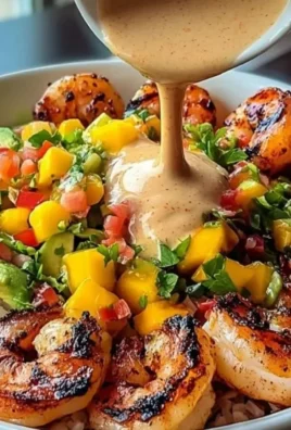 Delicious shrimp avocado bowls with mango salsa and lime-chili sauce