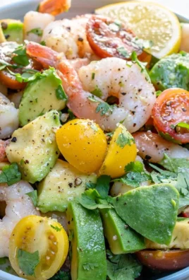 Shrimp avocado salad with tomatoes, a fresh and vibrant dish ideal for summer meals.