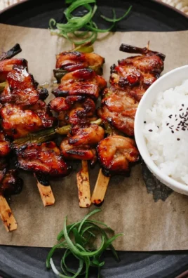 Delicious teriyaki chicken on a stick, grilled to perfection for a tasty meal.