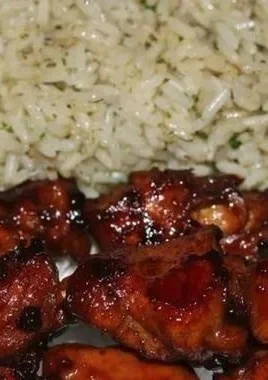 Delicious teriyaki chicken skewers on a grill.